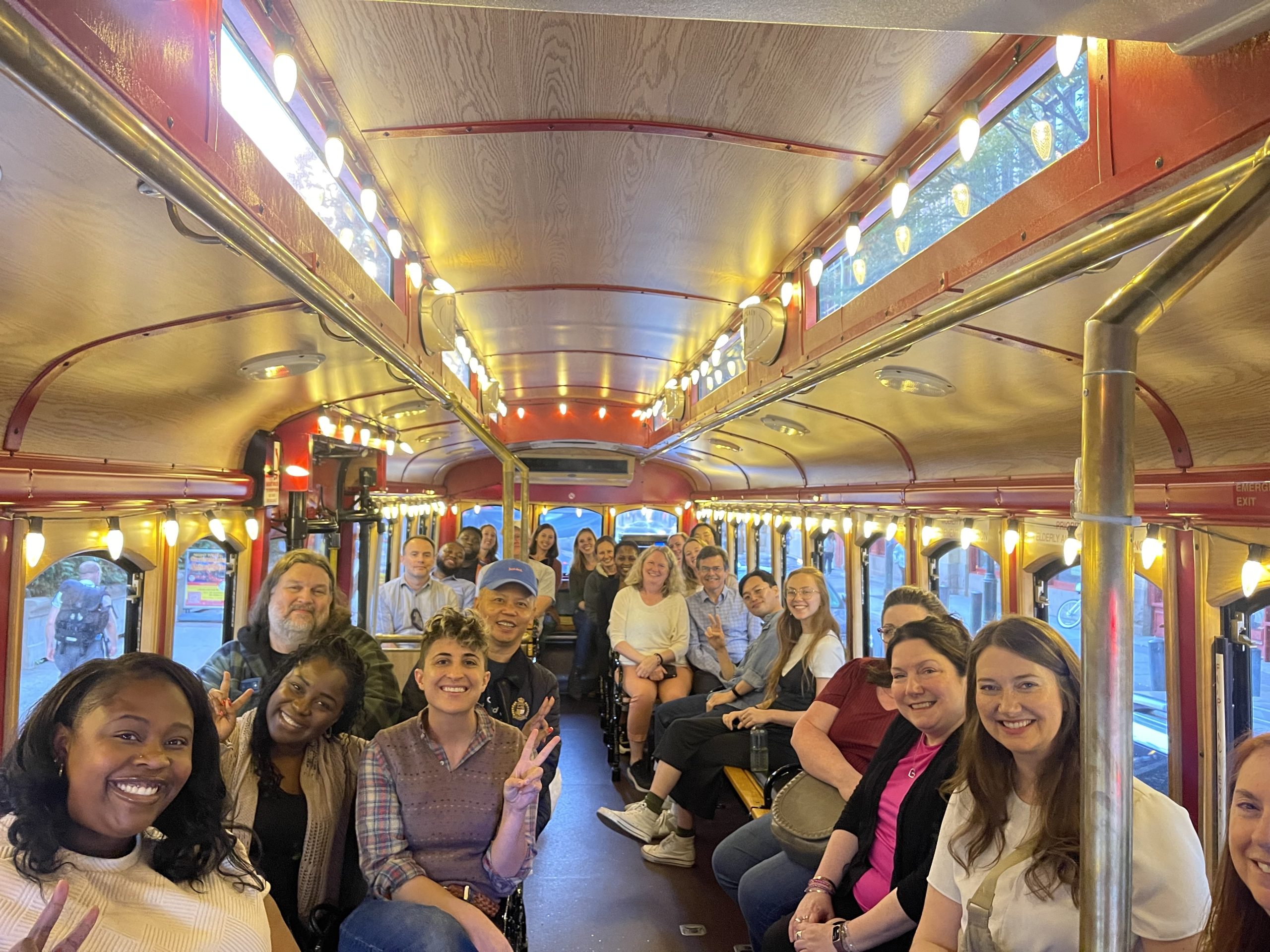 Image of QIP staff on a trolley during staff retreat.